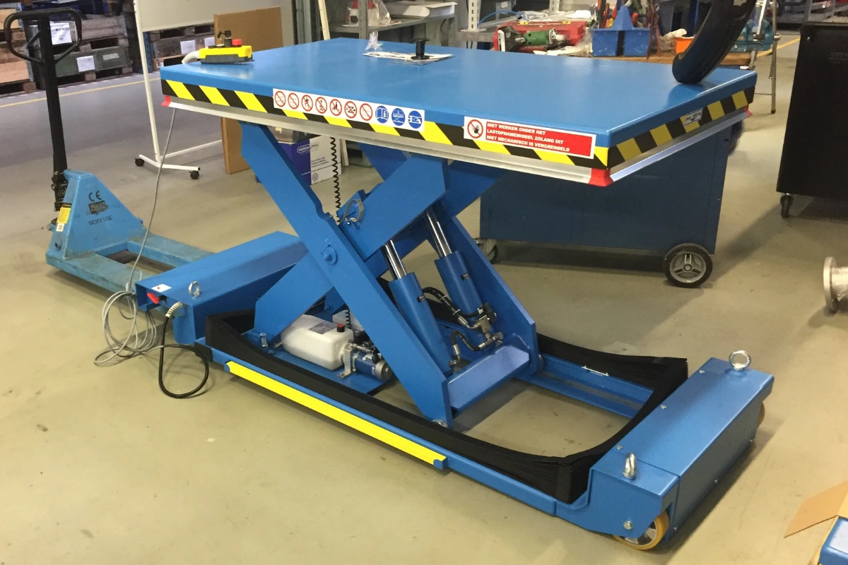 Slightly extended blue assembly table in warehouse