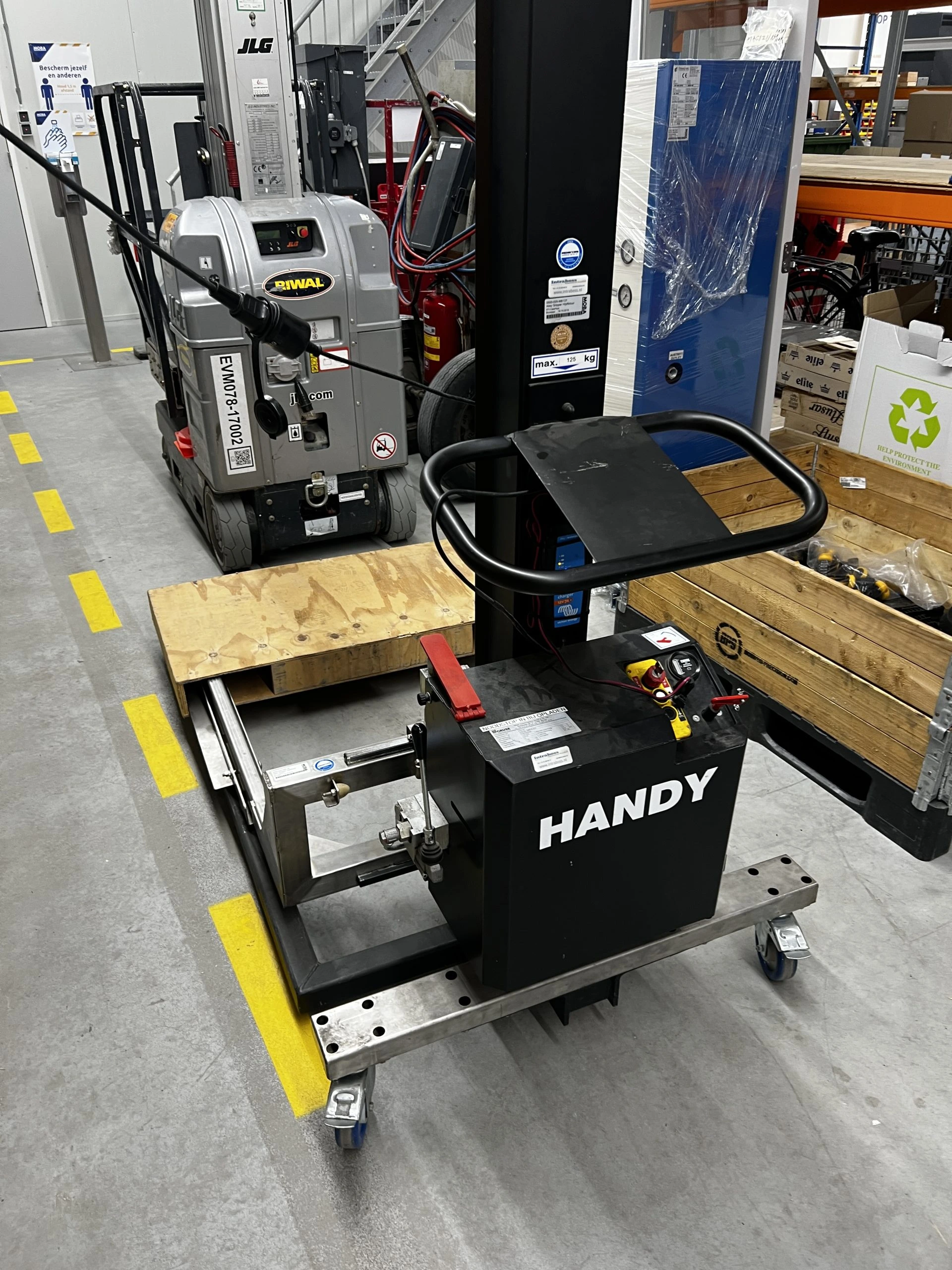 Handy mast lift in warehouse.