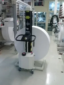 White mast lift in a warehouse.
