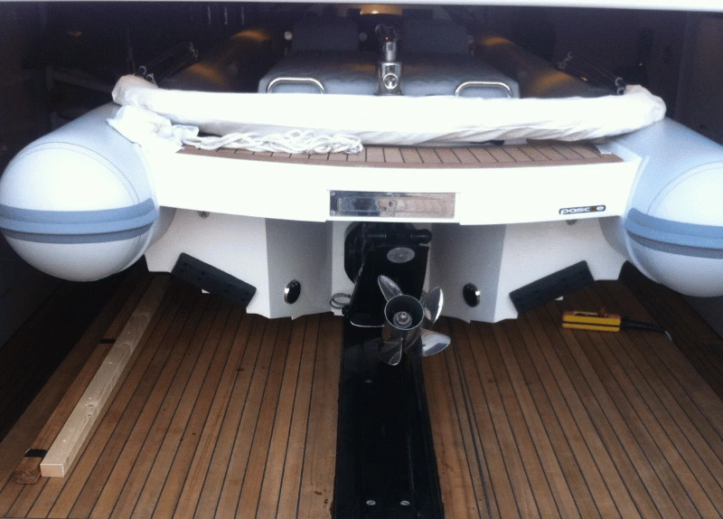 Yacht lift system with water toy tender on it.