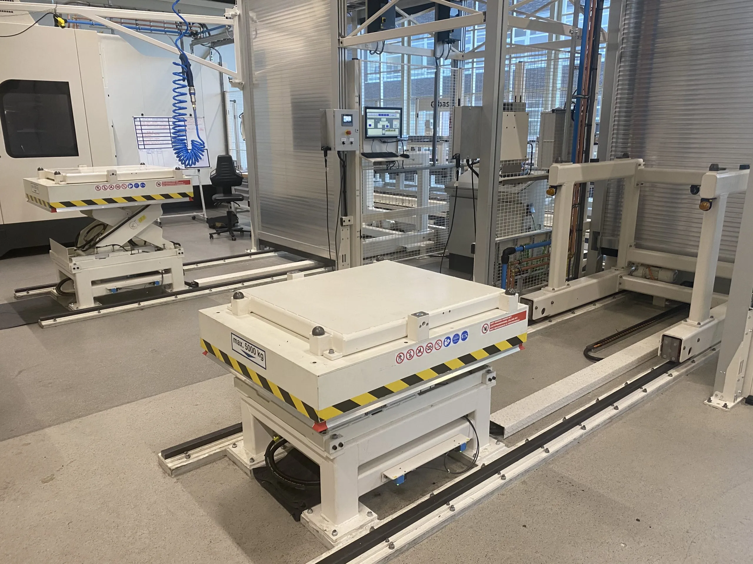 White pallet lifter in the warehouse space.