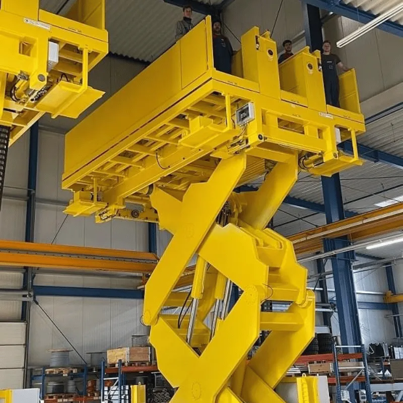 Yellow work platform with people stood at the top.